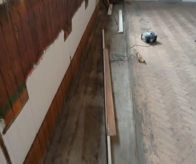 Removal of bench seating and creation of level floor space